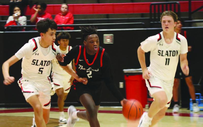 DOWNHILL - Levelland Lobo Elijah Jordan brought the ball down the court to break the Slatons press defense during the teams game Nov. 17. (Staff photo by Aalijah Soliz)