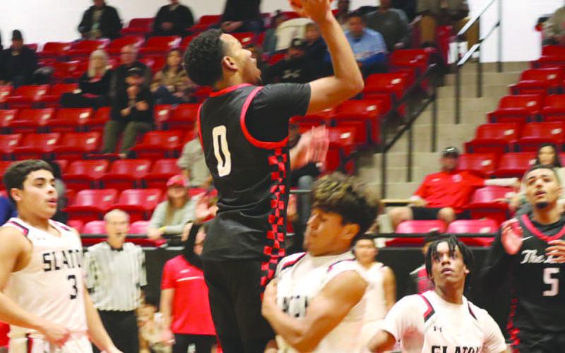 CAN’T STOP ME - Levelland Lobo Jaden Castillo attacked the rim and drew the foul on the Slaton Tiger defense in the teams comeback win November 17. (Staff photo by Aalijah Soliz)