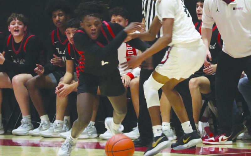SLIPPERY - Levelland Lobo Elijah Jordan poked the ball from the Slaton Tiger to cause turnover in the teams win. (Staff photo by Aalijah Soliz)