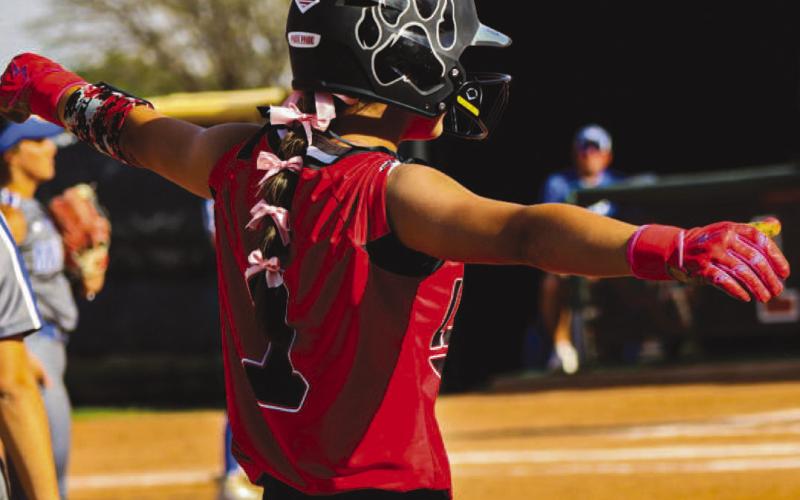 BASE HIT - Levelland Loboette Saydi Mendez celebrated with her team as she was able to get on third base during the team’s game against the Lake View Chiefs last Friday. Mendez finished with three runs and two walks in the game. (Staff photo by Aalijah Soliz)