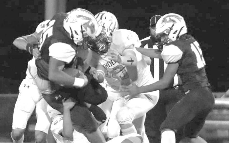 WRAP UP TACKLE - The Whiteface Antelope defense shut the host Meadow Broncos down in a 64-0 UIL Region II, District 5, 6-man Division I High school football win last Friday. The Antelopes, ranked sixth in the state and 12th in the country. will host O’Donnell next Friday for the district championship at 7:30 p.m. (Photo by Holly Crutcher)