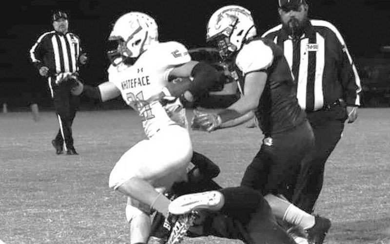STRONG RUNNING - Tyler Campbell carried the ball for the Whiteface Antelopes in a 64-0 shellacking of the Meadow Broncos last Friday in UIL Region II District 5, 6-man Division I High School football action last Friday. The Antelopes, ranked sixth in the state and 12th in the country. will host O’Donnell next Friday for the district championship at 7:30 p.m. (Photo by Holly Crutcher)
