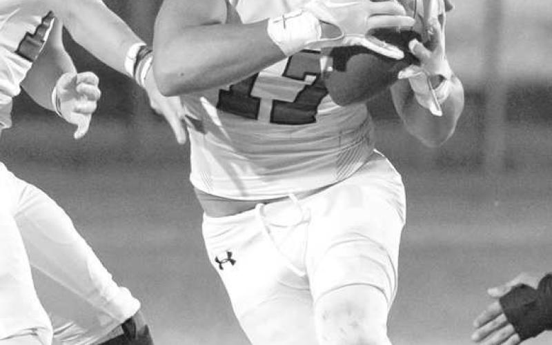 HANDOFF - Ropes quarterback Kade Franklin handed the ball of to Hayden Torres who had a great game racking up 98 rushing yards on the night last Friday against the Plains Cowboys. (Photo courtesy of Donovan Martin)