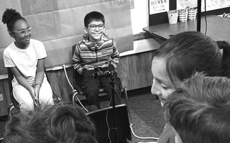 STUDENTS TEACHING STUDENTS- Mrs. Barbara Utley’s third grade GT students at Capitol got some help from Mr. Scott Lawson’s Digital Media &amp;amp; Career Prep students on their News Show Production project. Students learned how to use a green screen, read from a teleprompter, crop, edit recorded videos, and insert background. Pictured are Shaylle Whitfield and Landon Rodriguez (Photo courtesy of Cristal Isaacks)