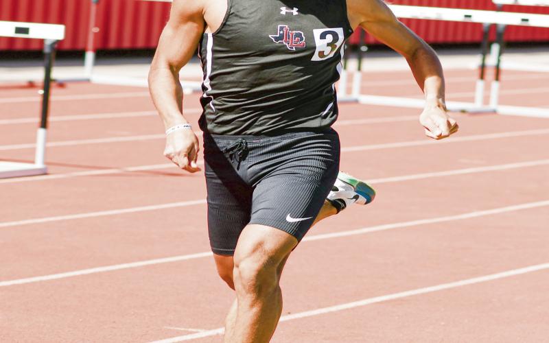 800-METER GRIT - Levelland's Saul Hernandez grits his teeth as his sprints to finish his 800-meter race this past Friday at Lobo Stadium. Hernandez would win the event with a time of 2:01.89. (Staff photo by Jentezen Smith)