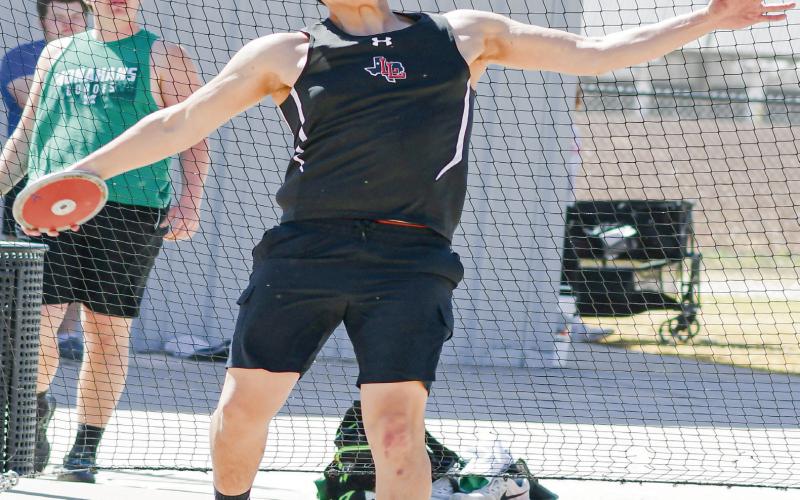 FULL EXTENSION THROW - Levelland’s Adan Perez fully extends during a discus throw this past Friday at Lobo Stadium. Hernandez would tie for first place in the event with a throw of 138’03”. (Staff photo by Jentezen Smith)