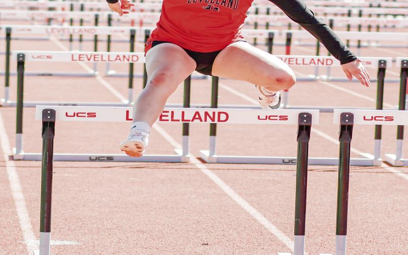 HURDLING FOCUS - Levelland’s Jurney Hernandez focuses intently as she clears the 10th and final hurdle during a race this past Friday at Lobo Stadium. Hernandez finished sixth overall with a time of 19.81. (Staff photo by Jentezen Smith)