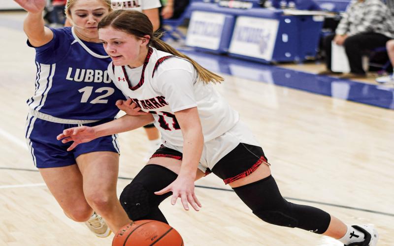 NEAL ON THE TAKE - Whitharral Lady Panther Sheridan Neal takes it to the basket during their basketball game against the Lubbock Titans in the Caprock Classic this past Tuesday at Estacado High School. (Staff photo by Jentezen Smith)