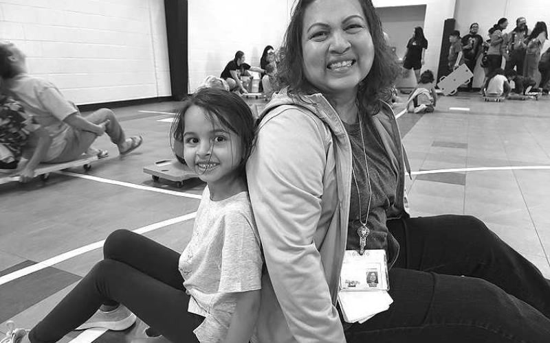 FAMILY FUN-- South Elementary hosted a Family Fitness Night recently. PE Teacher Pat Smith involved family members in fun activities that showed parents and students how important physical movement is for a healthy brain and body. Pictured are South first grader Violet Flores with her grandmother, Mirtha Garza, who is employed at South. (Submitted Photo)