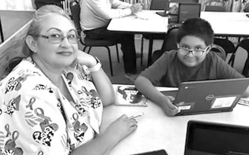 PARENT READING NIGHT-- Levelland Intermediate School hosted a Parent Reading Night to help students meet their reading goal in Mrs. Abi Swain’s Spooktakular Reading Challenge. Pictured are fourth grade student Jeremiah Puente and his Grandmother, Delfa Regalado, who is a custodian for LISD. (Submitted Photo)