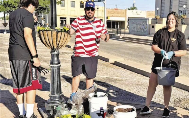 NEW SOIL- Community members worked this past Saturday, planting new plants around the courthouse lawn. (City of Levelland Main Street photo)