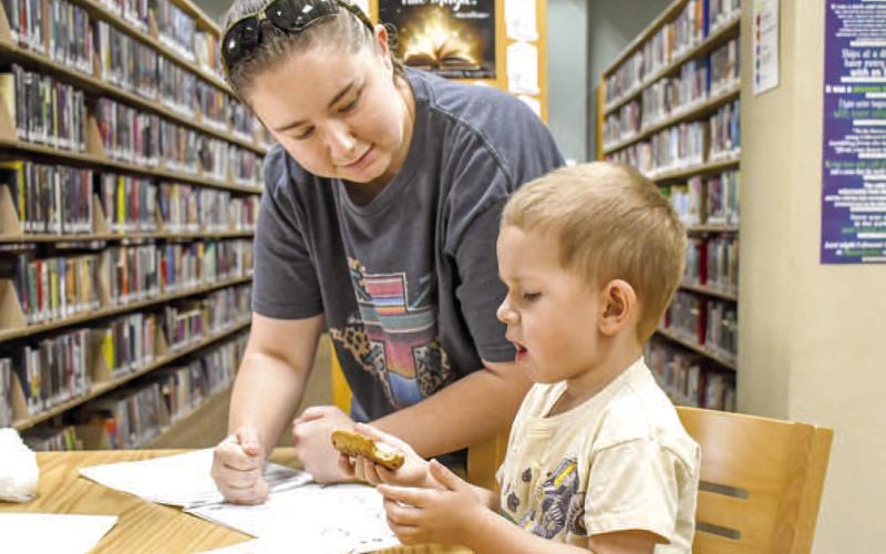 BOOKS &amp; BAGELS - Pictured are Michaela and Colt Dejoungh while they had a blast coloring and together at Books and Bagels on Wednesday at the Hockley County Memorial Library. (Staff photo by Hannah Woodrum)