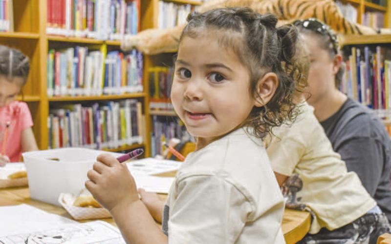 UNLEASHINGTHE INNERARTIST - Cynthia Chavez had a blast at Books and Bagels held on Wednesday at the Hockley County Memorial Library. (Staff photo by Hannah Woodrum)