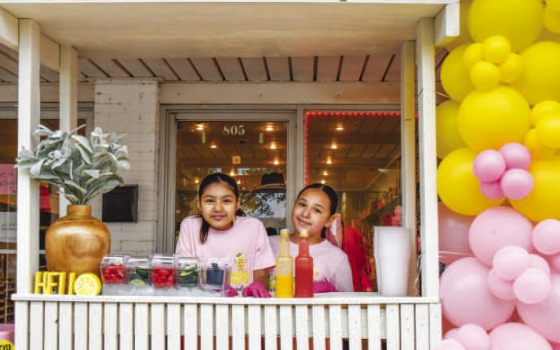 - Pictured is Sophia Lopez and Alicia Hernandez who won Best Decorated Stand on Saturday during Main Streets Lemonade Day and Community Planting Day. (Staff photo by Hannah Woodrum)