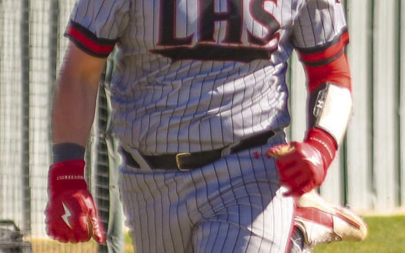 TOO FAST - Levelland Lobo Tyler Pemberton ran to third base during the teams contest this past Friday at home. (Staff photo by Dom Puente)