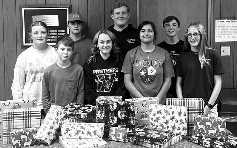 4-H CHRISTMAS PARTY-- Hockley County 4H council met Wednesday night for their annual Christmas party. Council members enjoyed dinner and games after they wrapped gifts that they purchased to be donated to local families. Pictured from the left, on the front row are: Bryan Sherril, Tyler Chase, Tyler Parkinson and Addie Hord; and back row: Charlie King, Tucker Parkinson, Carson Wood and Caden Crenshaw. (Submitted Photo)