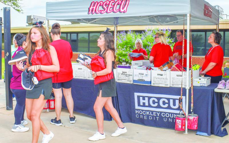 SHOE GIVEAWAY- The Hockley County Credit Union and Renegade organized a Shoe Drive for students. The shoes were disributed to local students that also recivied a Back-to-School Backpack at The Hockley County Voices Colalition Backpack Giveaway on Saturday at Capitol Elementary. The event assists students with back to school shoes and school supplies. (Photo courtesy of Emily Campos)