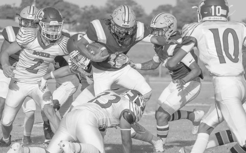 TOUGH RUN - Anton running back Gavin Martinez ran through the Booker defense to pick up some hard earned yards in their loss with a score of, 38-12. Anton’s next game is against White Deer as the away team at 7:00 p.m, to continue their season. (Staff photo by Aalijah Soliz)