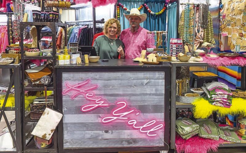 FARM GIRL FROSTING - Venders throughout the state attended the annual Petticoats on the Prairie event on Friday and Saturday. Traveling all the way from Claude, Tx, Tessa and Scott Waddell brought their booth to the Mallet Event Center and Arena. (Staff photo by Myra Guerrero)