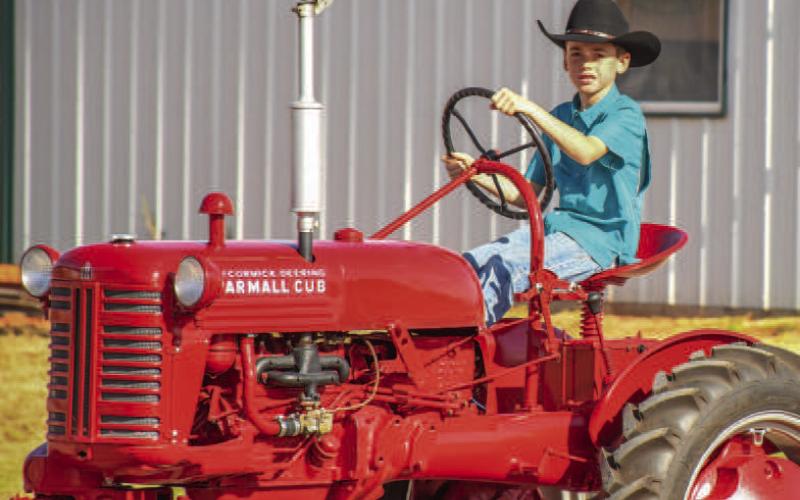 RIDING IN STYLE - The Sundown Chamber of Commerce held their annual Oil Patch Day event Saturday, which included the Oil Patch Day Parade to begin the day. Pictured is Sundown’s own Logan Jeffcoat participating in the parade. (Staff photo by Dom Puente)