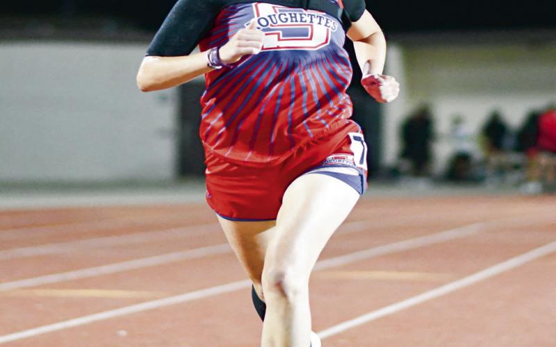 DOUBLE CHAMP - Sundown’s Kaytlin Clausen paces herself during a race this past Friday at the District Championships at Sundown High School. Clausen would be the District Champion in the 1,600 and 3,200. (Staff photo by Jentezen Smith)