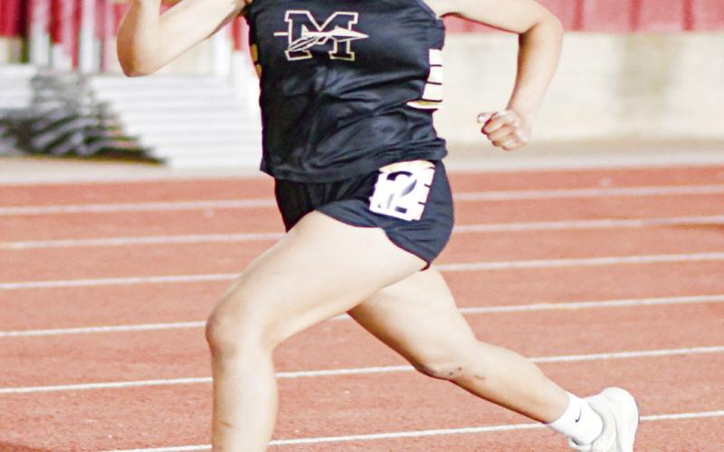 FINISH STRONG - Morton’s Maya Huckabee finishes her distance race strong this past Friday at the District Championships at Sundown High School. She ran a time of 6:51.63 to place sixth in the mile race. (Staff photo by Jentezen Smith)