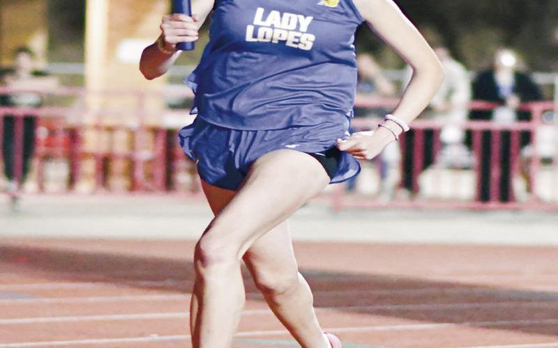4X400 RELAY LEG - Whiteface’s Abi Soliz runs her leg of the 4x400-meter relay this past Friday at the District Championships at Sundown High School.The relay would place third with a time of 4:27.73. (Staff photo by Jentezen Smith)