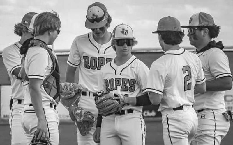 MEETING - The Ropes Eagles met on the mound before the inning started during their game against the Tahoka Bulldogs this past Tuesday at home. (Staff photo by Aalijah Soliz)