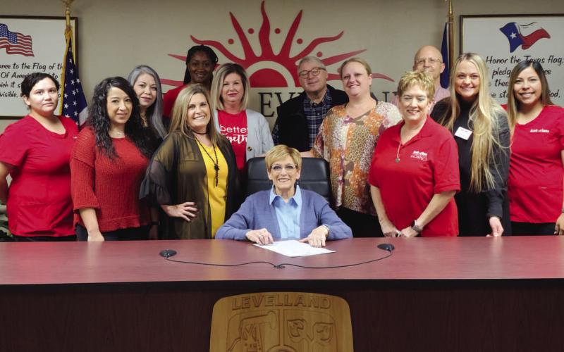 NATIONAL HEALTH CARE, HOSPICE MONTH - Members of Interim Health for Levelland met along side City of Levelland Mayor Barbra Pinner at city hall as she proclaimed November as National Home Care and Hospice Month. Interim Home Health, the National Association for Home Care and Hospice, and thousands of home care agencies across the U.S. have declared the month of November as National Home Care and Hospice Month. (Staff Photo by Dom Puente)