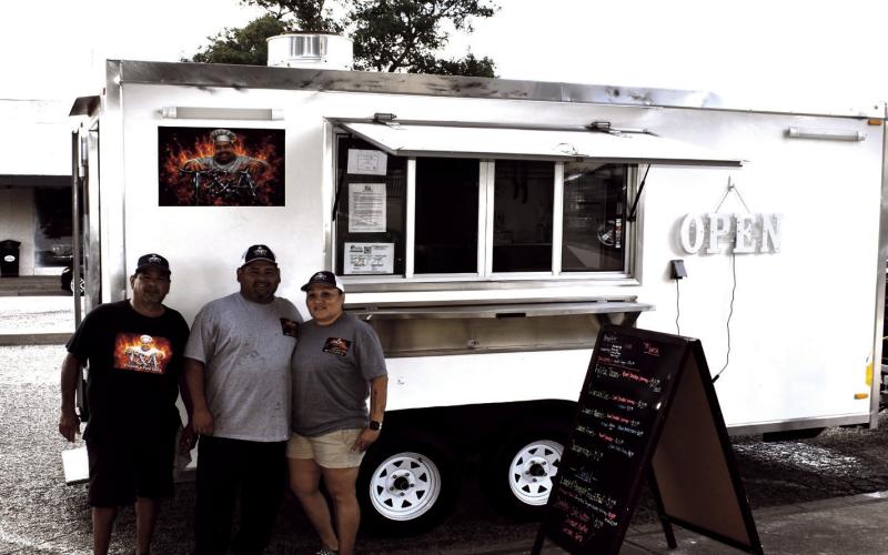 T&amp;A – Pictured are Amador, Troy and Jennifer Andrade with their truck on the square. Every third Thursday from March to September is Food Truck Day Day. (Staff photo by Ada Niederhauser)