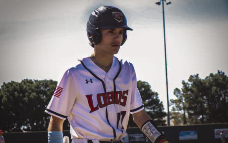 GAME TIME - Levelland Lobo Rance Massey headed over to the dugout during the team’s home game against the Denver Ciety Mustangs this past Tuesday. (Staff photo by Aalijah Soliz)