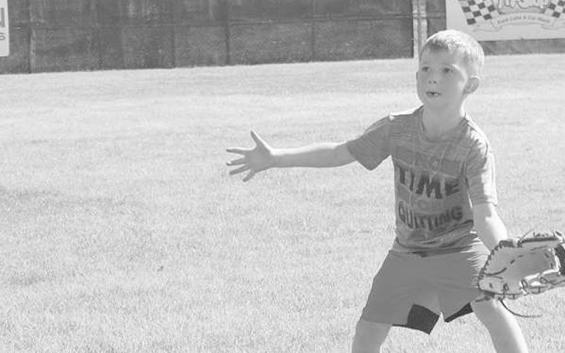 CATCH- Crager Miller gets ready to catch the ball at the Loboette softball camp. The camp kicked off Monday and was led by head coach Ryan Miller. Several former Loboette players were also in attendace helping with the camp. (Staff Photo by Aalijah Soliz)