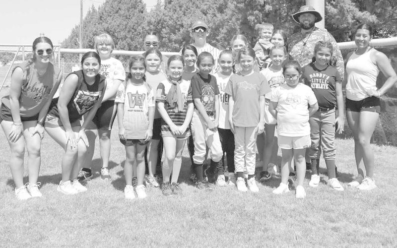 SAY CHEESE- Loboette Softball Camp was held June 19 - June 20, these were the bunch of kids that showed up and participated to learn more. The camp started at 9am to 11:30 am. Pictured above is the group that showed up and learned. The camp was led by head coach Ryan Miller and several former players. (Staff Photo by Aalijah Soliz)
