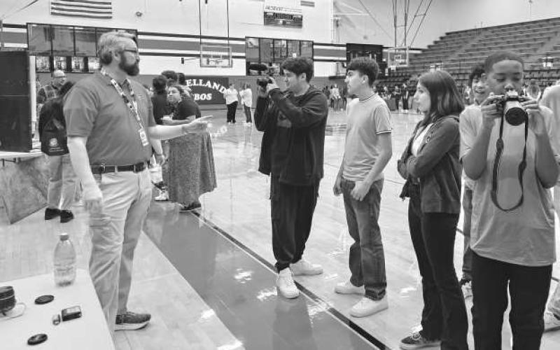 ORIENTATION- LHS recently hosted their Annual 8th-Grade Orientation. Principal Dr. Matthew Birdwell started the event off by encouraging students to always do their best and to pay attention at all times. Students then learned about all the award-winning CTE courses that they can take at LHS. Pictured is Mr. Lawson’s Digital Technology Booth. From left to right are: Mr. Lawson, Marcus Dent, Madisyn Davidson, Julio Ramos and Dominique Carrasco. (Photo submitted by Cristal Isaacks)