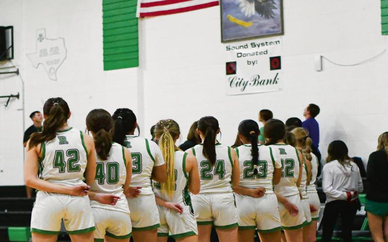 NATIONAL ANTHEM - The Ropes Lady Eagles stand in line as the National Anthem plays before their basketball game against Olton this past Tuesday at Ropes High School. The Lady Eagles would fall to them 70-49, dropping their record to 1-1 on the young season. (Staff photo by Jentezen Smith)
