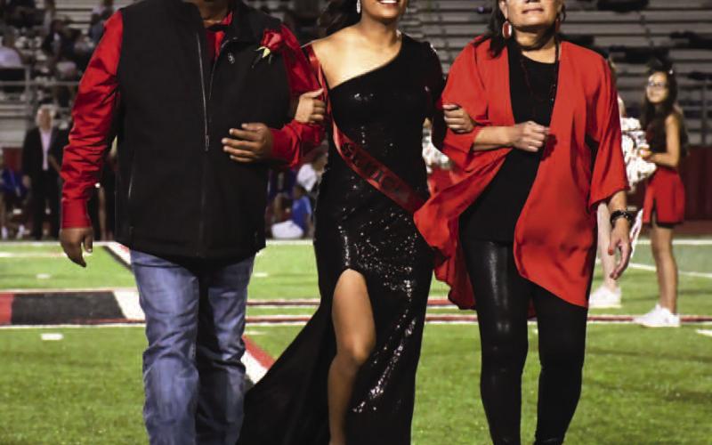 SENIORHOMECOMING - Levelland High School held their Homecoming last week during the Lobos vs. Estacado football game on Friday. Making up the Homecoming Court was senior Chloe Constantino who was escorted by her parents Daniel and Norma Constantino. (Staff Photo by Dominick Puente)