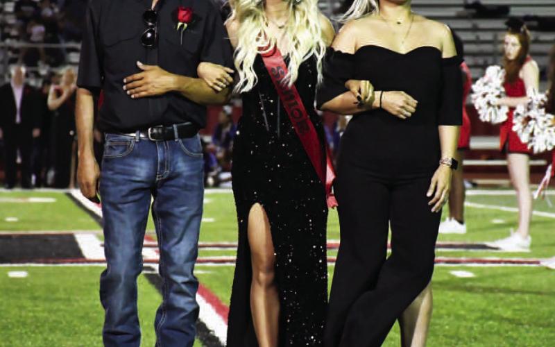 HOMECOMINGUNDERTHELIGHTS - Levelland High School held their Homecoming last week during the Lobos vs. Estacado football game on Friday. Making up the Homecoming Court was senior Heidi Marquez was escorted by her parents Hugo and Yessica Marquez. (Staff Photo by Dominick Puente)