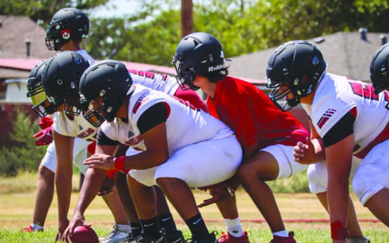 TEMPO - Levelland Lobo Boston Winfield took the snap under center during the team’s tempo drills to work on their conditioning this past Monday at the Levelland High School during two-a-days. (Staff photo by Aalijah Soliz)
