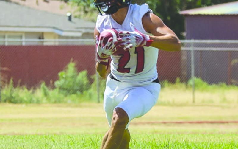 CUT-BACK - Levelland Lobo Ricky Rodriguez cut the run back to the left side of the line this past Monday during the team’s two-a-days workouts. (Staff photo by Aalijah Soliz)