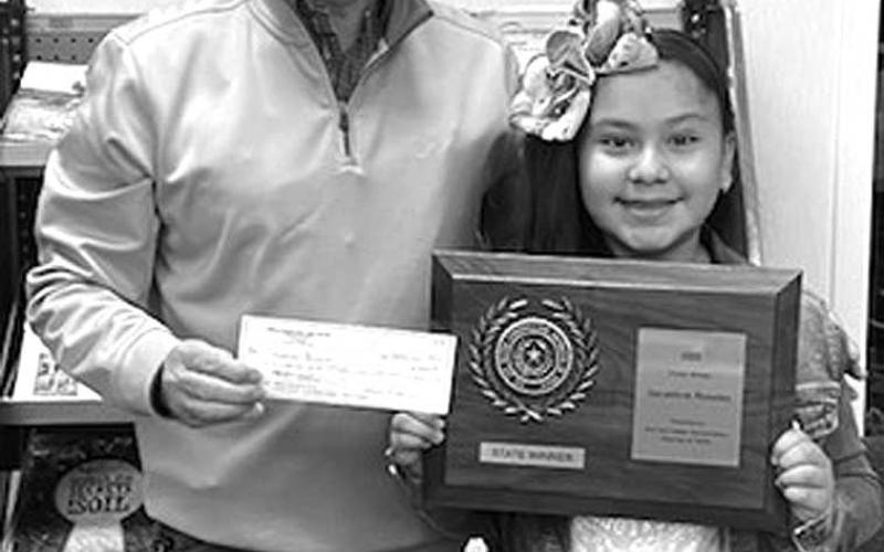 SWCD STATE WINNER!-- Geraldine Rosales won the 2022 State of Texas Soil and Water Conservation Board Poster Contest with her poster she made in third grade for the Hockley Soil and Water Conservation District #129. Her poster will advance to the National contest in December. Pictured presenting Gereldine with her state plaque and $500 award is Ronnie Alexander, chairman of the board for the Hockley County Soil and Water Conservation District. (Submitted Photo)