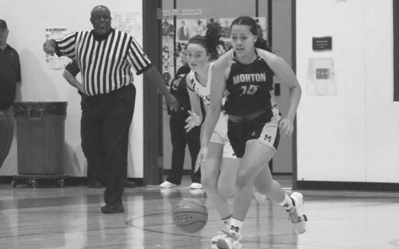 DOWNHILL - Morton Maiden Ruby Gutierrez brought the ball down the court during the teams game this past Monday against All-Saints. (Staff photo by Aalijah Soliz)