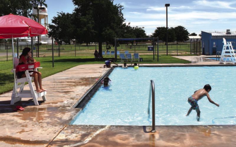 - Pictured is lifeguard Makaylyn Dominguez watching out for local children at the Levelland City Pool. Many high school students work at the pool, and it is a good way to beat the heat while having fun. (Staff photo by Ada Niederhauser)