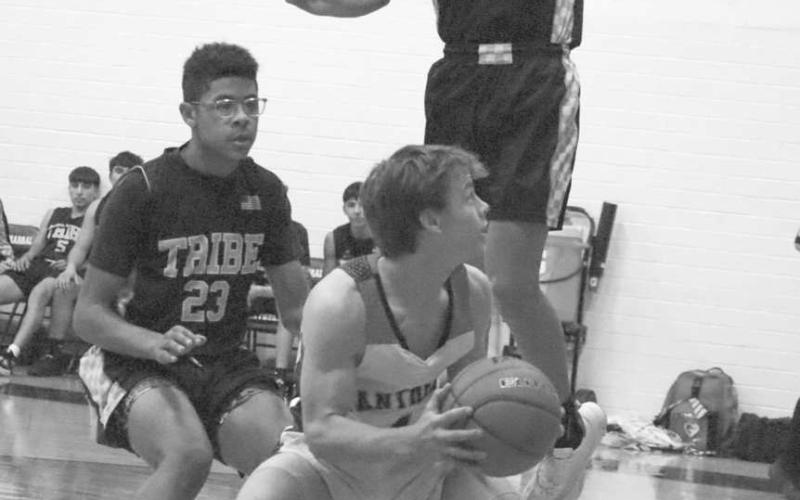PUMP FAKE - Whitharral Panther Brolin Kennedy pump faked the ball to get Morton defender E.J. Rivas to jump during their contest last week to compete for the number one seed in district play. (Staff photo by Aalijah Soliz)