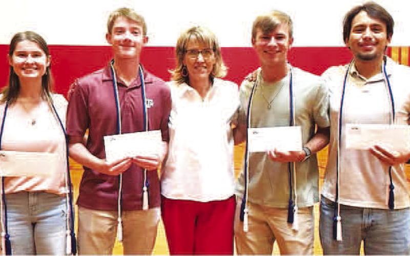 (YELL) SCHOLARSHIPS-- Young Emerging Leaders of Levelland (YELL) students received $1,000 scholarships recently. Shown with Levelland Chamber of Commerce Mary Siders are Ada Niederhauser, W. Michael Canon, Nathan Ellis and Brady Houston who have been active with the organization in making a difference for others in Levelland. (Levelland ISD photo)