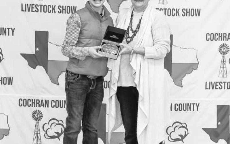 RESREVE GRAND CHAMPION GOAT- Parks Tucker was presented a buckle for Reserve Grand Champion Goat doanted and presented by Wayne and Cheri Butler on Saturday at the Cochran County Livestock Show in Morton. (staff photo by Essence Childers)