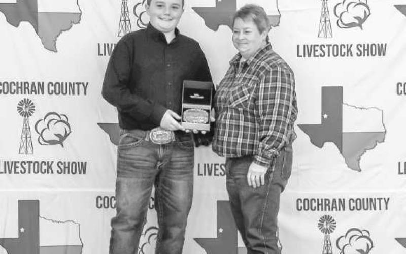 GRAND CHAMPION BARROW- Mason Albus was awarded a buckle for Grand Champion Barrow donated and presented by Cochran County Schools Federal Credit Union at the Cochrna County Livestock Show this past weekend in Morton. (Staff photo by Essence Childers)