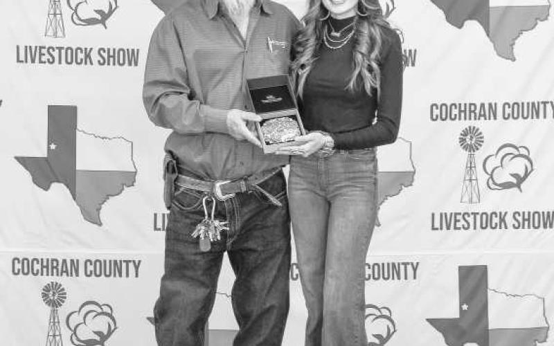 SENIOR SWINE SHOWMAN - McKinley Tucker was awarded a buckle for Senior Swine Showman donated by Dan and Tammie Bowman and presented by Billy Joe Roberts at the Cochran County Livestock Show in Morton. (Staff photo by Essence Childers)