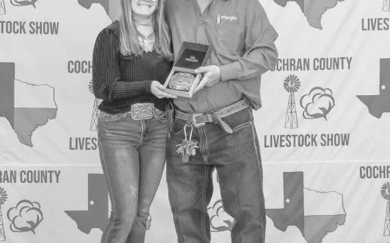 SENIOR GOAT SHOWMAN - Emma Kerby was presented a buckle for Senior Goat Showman donated by Danielle Dobson and presented by Billy Joe Roberts at the Cochran County Livestock Show in Morton. (Staff photo by Essence Childers)