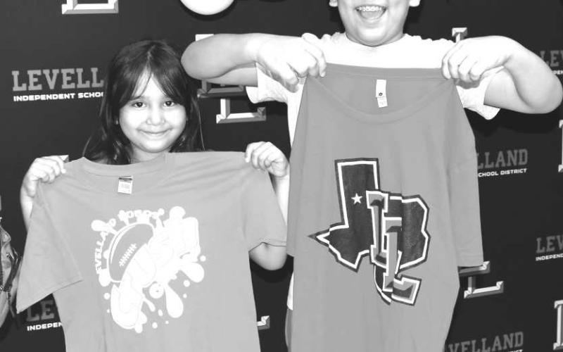 GREAT SMILES - Several famalies participated in the back to school night at Levelland Middle School last week. Brother and sister Adan Alvarez and Alyse Alvarez were excited to buy Levelland Lobo shirts and are ready to start the new school year. (Staff photo by Emily Campos)