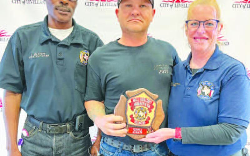 ROUND OFAPPLAUSE - Willie Goolseby (center) was awarded the Volunteer - Firefighter of the Year at the LFD awards banquet held on Saturday. Pictured alongside Goolseby is Curt Masters (left) and Interim Fire Chief Patty Byars-Faulkner (right). (Photo courtesy of the LFD)